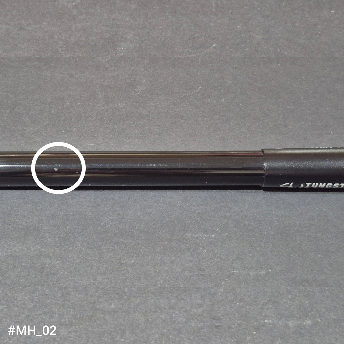 A discounted RamRods Matterhorn archery stabilizer, tungsten damping, 30 inch. A chip in the shaft surface is circled in white.